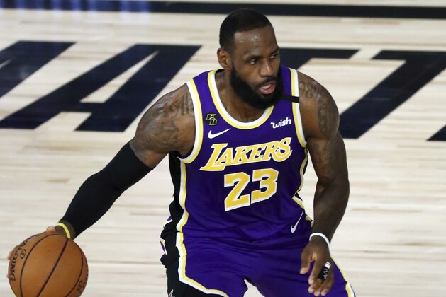 Los Angeles Lakers forward LeBron James controls the ball during the second quarter of an NBA basketball game against the Indiana Pacers, Saturday, Aug. 8, 2020, in Lake Buena Vista, Fla. (Kim Klement/Pool Photo via AP)
