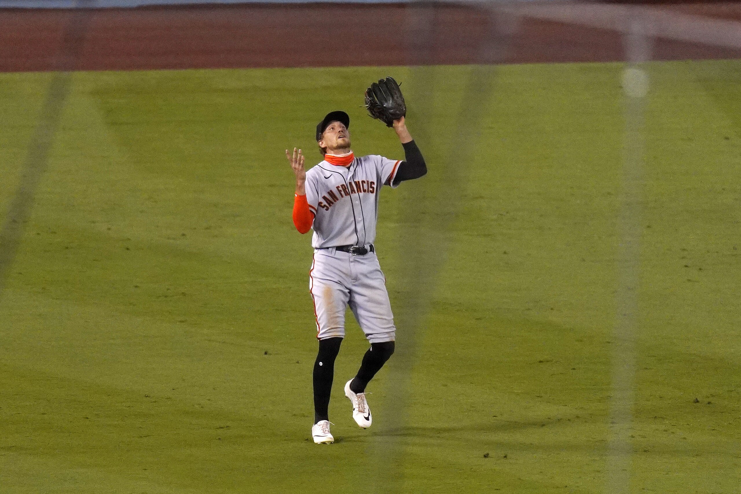 San Francisco Giants left fielder Hunter Pence can't find a fly ball hit by Los Angeles Dodgers' Enrique HernÃ¡ndez for a triple during the sixth inning of a baseball game Saturday, Aug. 8, 2020, in Los Angeles. (AP Photo/Mark J. Terrill)