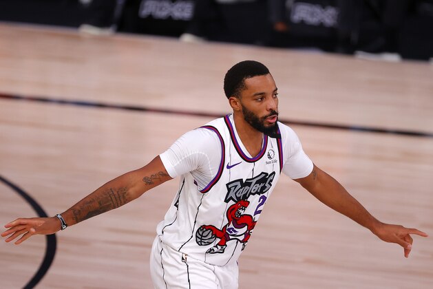 Norman Powell of the Toronto Raptors reacts after scoring during the first half of an NBA basketball game Sunday, Aug. 9, 2020, in Lake Buena Vista, Fla. (Kevin C. Cox/Pool Photo via AP)