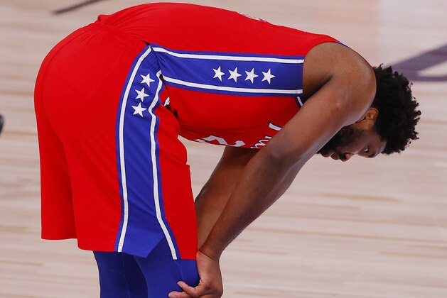 Philadelphia 76ers' Joel Embiid reacts during an NBA basketball game against the Portland Trail Blazers, Sunday, Aug. 9, 2020, in Lake Buena Vista, Fla. (Kevin C. Cox/Pool Photo via AP)
