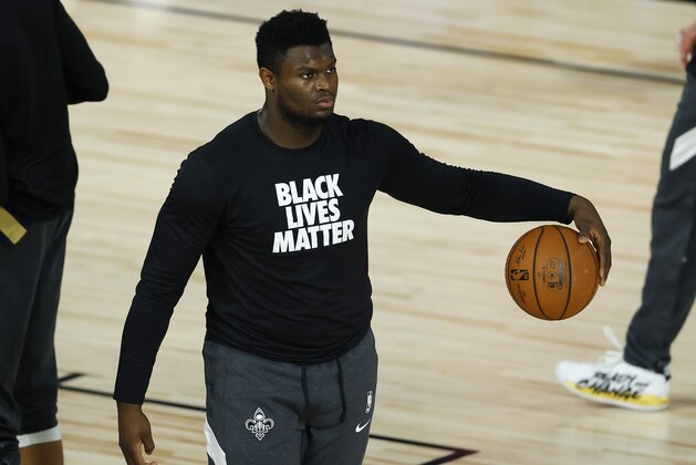 New Orleans Pelican's Zion Williamson warms up for the team's NBA basketball game against the Los Angeles Clippers on Saturday, Aug. 1, 2020, in Lake Buena Vista, Fla. (Kevin C. Cox/Pool Photo via AP)