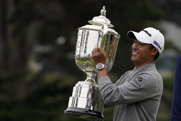 Collin Morikawa holds the Wanamaker Trophy after winning the PGA Championship golf tournament at TPC Harding Park Sunday, Aug. 9, 2020, in San Francisco. (AP Photo/Charlie Riedel)
