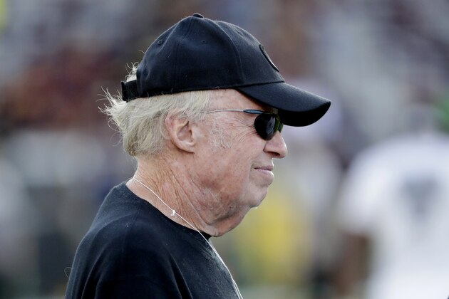 Nike chairman Phil Knight stands on the sideline prior to an NCAA college football game between Oregon and Arizona State, Saturday, Nov. 23, 2019, in Tempe, Ariz. (AP Photo/Matt York)