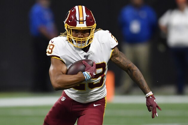 Washington Redskins running back Derrius Guice (29) runs against the Atlanta Falcons during the first half an NFL preseason football game, Thursday, Aug. 22, 2019, in Atlanta. (AP Photo/Mike Stewart)