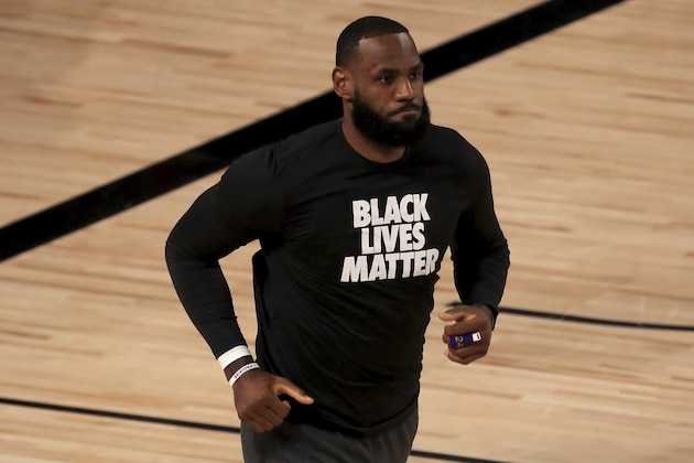 Los Angeles Lakers' LeBron James takes to the court prior to an NBA basketball game against the Los Angeles Clippers, Thursday, July 30, 2020 in Lake Buena Vista, Fla. (Mike Ehrmann/Pool Photo via AP)