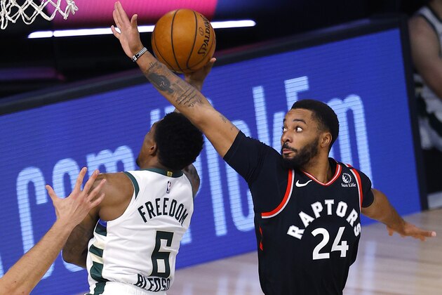 Toronto Raptors' Norman Powell, right, defends against Milwaukee Bucks' Eric Bledsoe during the third quarter of an NBA basketball game Monday, Aug. 10, 2020, in Lake Buena Vista, Fla. (Mike Ehrmann/Pool Photo via AP) Toronto Raptors' Norman Powell, right, defends against Milwaukee Bucks' Eric Bledsoe during the third quarter of an NBA basketball game Monday, Aug. 10, 2020, in Lake Buena Vista, Fla. (Mike Ehrmann/Pool Photo via AP)