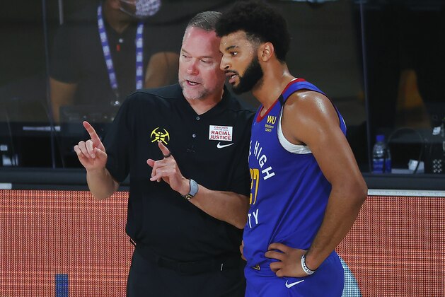 Denver Nuggets head coach Michael Malone talks with Jamal Murray during the third quarter against the Utah Jazz in an NBA basketball game Saturday, Aug. 8, 2020, in Lake Buena Vista, Fla. (Kevin C. Cox/Pool Photo via AP)