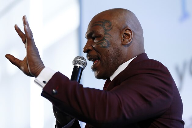 Boxer Mike Tyson speaks during the 4th Annual New Jersey Prisoner Reentry Conference, Thursday, April 13, 2017, in Jersey City, N.J. During the event, Tyson presented New Jersey Gov. Chris Christie with a championship belt for his efforts in helping former prisoners reinstall themselves into society. (AP Photo/Julio Cortez)