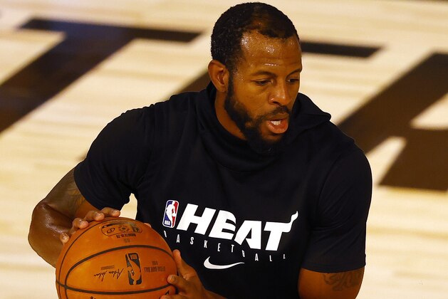 Miami Heat's Andre Iguodala warms-up before an NBA basketball game against the Denver Nuggets, Saturday, Aug. 1, 2020, in Lake Buena Vista, Fla. (Kevin C. Cox/Pool Photo via AP)