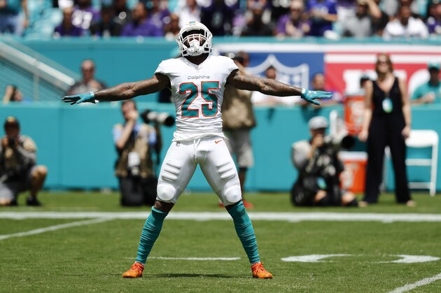 Miami Dolphins cornerback Xavien Howard (25) reacts to blocking a pass against a Baltimore Ravens player during an NFL football game, Sunday, Sept. 8, 2019, in Miami Gardens, Fla. The Ravens defeated the Dolphins 59-10. (AP Photo/Brynn Anderson) Miami Dolphins cornerback Xavien Howard (25) reacts to blocking a pass against a Baltimore Ravens player during an NFL football game, Sunday, Sept. 8, 2019, in Miami Gardens, Fla. The Ravens defeated the Dolphins 59-10. (AP Photo/Brynn Anderson)
