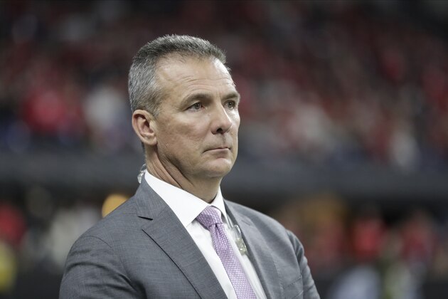 Former Ohio State head coach Urban Meyer watches during the second half of the Big Ten championship NCAA college football game between Ohio State and Wisconsin, Saturday, Dec. 7, 2019, in Indianapolis. (AP Photo/Michael Conroy)