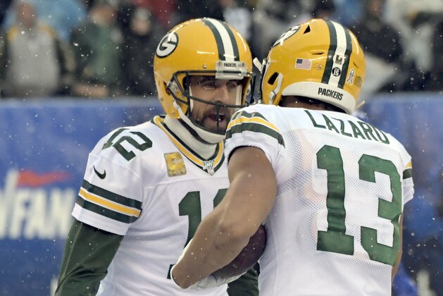 Green Bay Packers quarterback Aaron Rodgers, left, celebrates with Allen Lazard after a touchdown during the first half of an NFL football game against the New York Giants, Sunday, Dec. 1, 2019, in East Rutherford, N.J. (AP Photo/Bill Kostroun)