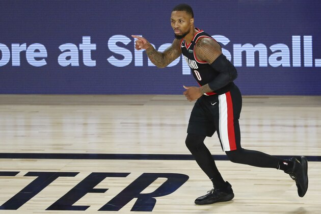 Portland Trail Blazers guard Damian Lillard reacts after making a 3-point basket against the Dallas Mavericks during the second half of an NBA basketball game Tuesday, Aug. 11, 2020, in Lake Buena Vista, Fla. (Kim Klement/Pool Photo via AP) Portland Trail Blazers guard Damian Lillard reacts after making a 3-point basket against the Dallas Mavericks during the second half of an NBA basketball game Tuesday, Aug. 11, 2020, in Lake Buena Vista, Fla. (Kim Klement/Pool Photo via AP)
