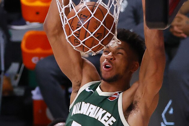 Milwaukee Bucks' Giannis Antetokounmpo (34) dunks against the Dallas Mavericks during overtime of an NBA basketball game Saturday, Aug. 8, 2020, in Lake Buena Vista, Fla. (Kevin C. Cox/Pool Photo via AP) Milwaukee Bucks' Giannis Antetokounmpo (34) dunks against the Dallas Mavericks during overtime of an NBA basketball game Saturday, Aug. 8, 2020, in Lake Buena Vista, Fla. (Kevin C. Cox/Pool Photo via AP)