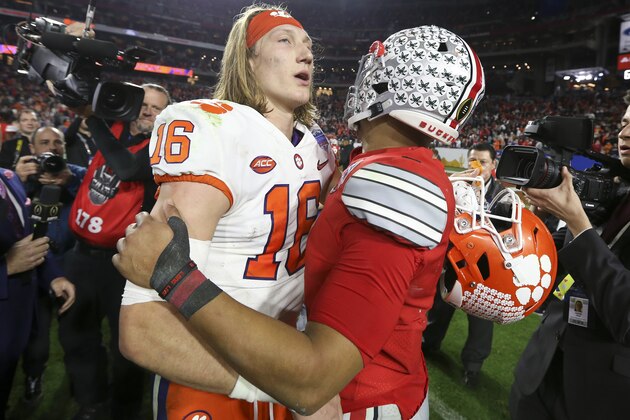 Clemson quarterback Trevor Lawrence, left, and Ohio State quarterback Justin Fields meet after the Fiesta Bowl NCAA college football playoff semifinal Saturday, Dec. 28, 2019, in Glendale, Ariz. (AP Photo/Ross D. Franklin) Clemson quarterback Trevor Lawrence, left, and Ohio State quarterback Justin Fields meet after the Fiesta Bowl NCAA college football playoff semifinal Saturday, Dec. 28, 2019, in Glendale, Ariz. (AP Photo/Ross D. Franklin)