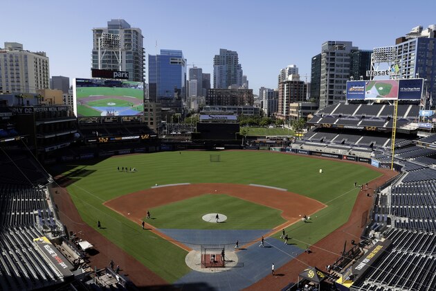 Players walk off the field during baseball training at Petco Park, Monday, July 6, 2020, in San Diego. (AP Photo/Gregory Bull)