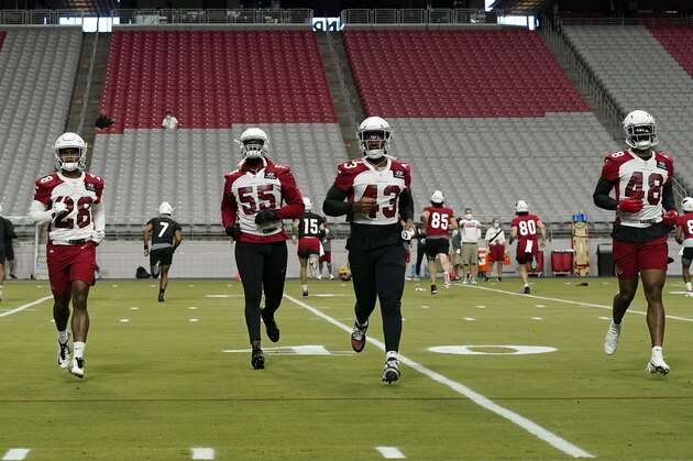 From left to right, Arizona Cardinals' Duke Thomas, Charles Washington, Chandler Jones, Haason Reddick and Isaiah Simmons run sprints during an NFL football workout inside State Farm Stadium Wednesday, Aug. 12, 2020, in Glendale, Ariz. (AP Photo/Ross D. Franklin)