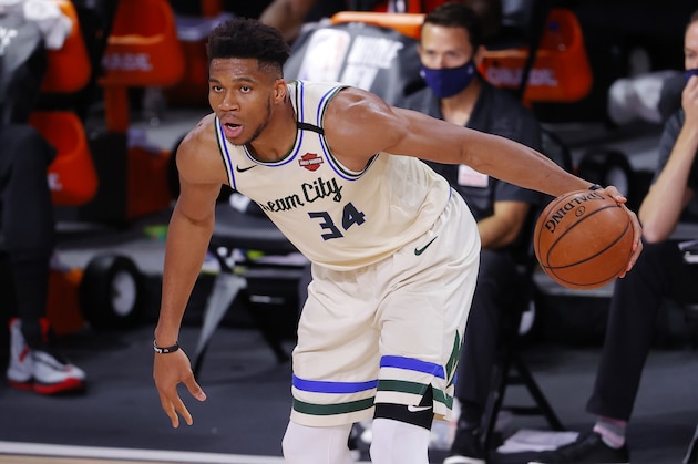 Milwaukee Bucks' Giannis Antetokounmpo looks to move the ball against the Houston Rockets during an NBA basketball game Sunday, Aug. 2, 2020, in Lake Buena Vista, Fla. (Mike Ehrmann/Pool Photo via AP)