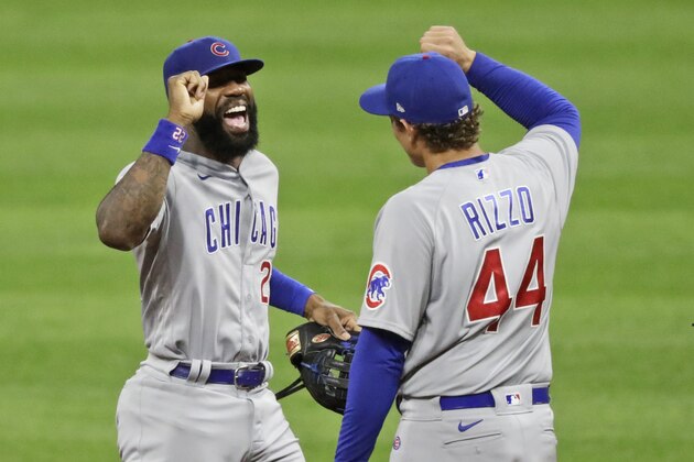 Chicago Cubs' Jason Heyward, left, is congratulated by Anthony Rizzo after the Cubs defeated the Cleveland Indians 7-1 in a baseball game, Tuesday, Aug. 11, 2020, in Cleveland. (AP Photo/Tony Dejak)