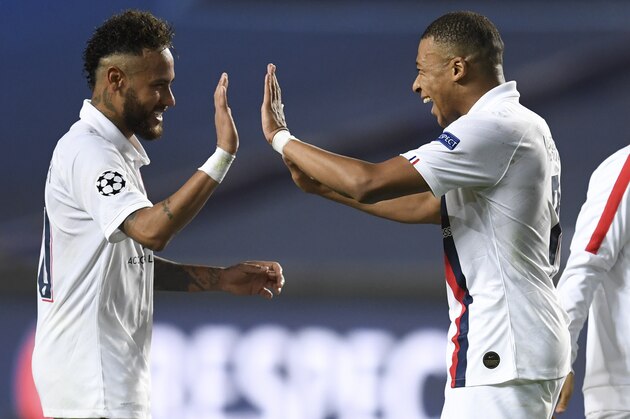 PSG's Neymar, left, celebrates with teammate PSG's Kylian Mbappe, right, after his team's win in the Champions League quarterfinal match between Atalanta and PSG at Luz stadium, Lisbon, Portugal, Wednesday, Aug. 12, 2020. (David Ramos/Pool Photo via AP)