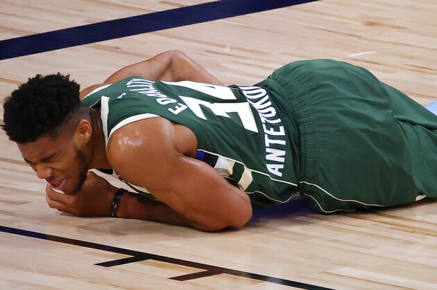 Milwaukee Bucks' Giannis Antetokounmpo grimaces after being fouled by a Dallas Mavericks player during an NBA basketball game Saturday, Aug. 8, 2020, in Lake Buena Vista, Fla. (Kevin C. Cox/Pool Photo via AP) Milwaukee Bucks' Giannis Antetokounmpo grimaces after being fouled by a Dallas Mavericks player during an NBA basketball game Saturday, Aug. 8, 2020, in Lake Buena Vista, Fla. (Kevin C. Cox/Pool Photo via AP)