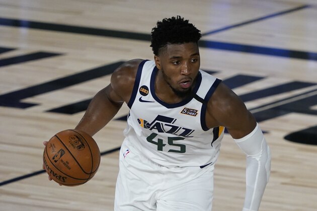 Utah Jazz guard Donovan Mitchell (45) takes the ball down the court during an NBA basketball game against the New Orleans Pelicans Thursday, July 30, 2020, in Lake Buena Vista, Fla. (AP Photo/Ashley Landis, Pool)