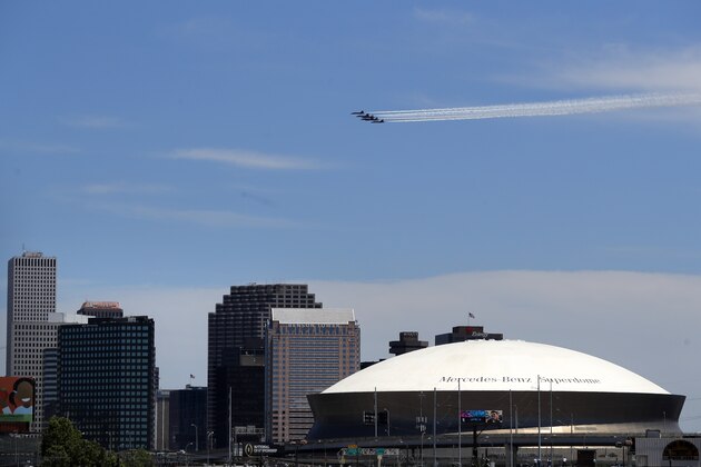 The Blue Angels, the U.S. Navy flight demonstration squadron, flies over downtown New Orleans and the Mercedes-Benz Superdome, as a salute to the health care front line responders working to help the sick during the coronavirus pandemic, Wednesday, May 6, 2020. (AP Photo/Gerald Herbert)