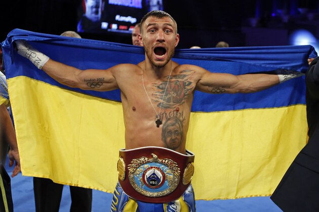 FILE - In this Dec. 9, 2017, file photo, Vasiliy Lomachenko, of Ukraine, celebrates after defeating Guillermo Rigondeaux in a WBO junior lightweight title boxing match in New York. Lomachenko is back and ready to show what he can do with two healthy shoulders. Injured while winning one lightweight belt, Lomachenko while try to add a second in his return from surgery when he faces Jose Pedraza on Saturday night in the Theater at Madison Square Garden. (AP Photo/Adam Hunger, File)