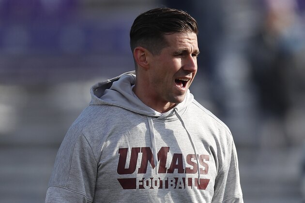 Massachusetts' Walt Bell watches before the start of an NCAA college football game against Northwestern Saturday, Nov. 16, 2019, in Evanston, Ill. (AP Photo/Jim Young)
