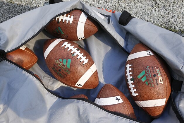 A bag of footballs are shown during warmups before the start of an NCAA College football game between Miami and Georgia Tech, Saturday, Oct. 14, 2017 in Miami Gardens, Fla. Miami defeated Georgia Tech 25-24. (AP Photo/Wilfredo Lee)