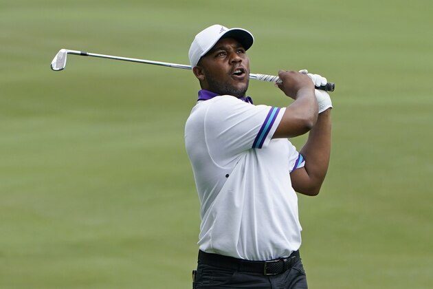 Harold Varner III watches his shot on the 18th hole during the first round of the Wyndham Championship golf tournament at Sedgefield Country Club on Thursday, Aug. 13, 2020, in Greensboro, N.C. (AP Photo/Chris Carlson)
