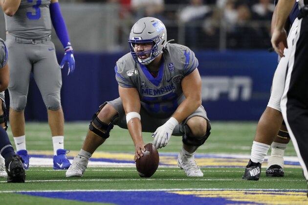 Memphis center Dustin Woodard (53) prepares for the snap of the ball during the second half of the NCAA Cotton Bowl college football game against Penn State in Arlington, Texas, Saturday, Dec. 28, 2019. (AP Photo/Roger Steinman)