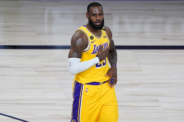 Los Angeles Lakers' LeBron James (23) reacts after a basket during the first half of an NBA basketball game against the Denver Nuggets, Monday, Aug. 10, 2020, in Lake Buena Vista, Fla. (AP Photo/Ashley Landis, Pool)