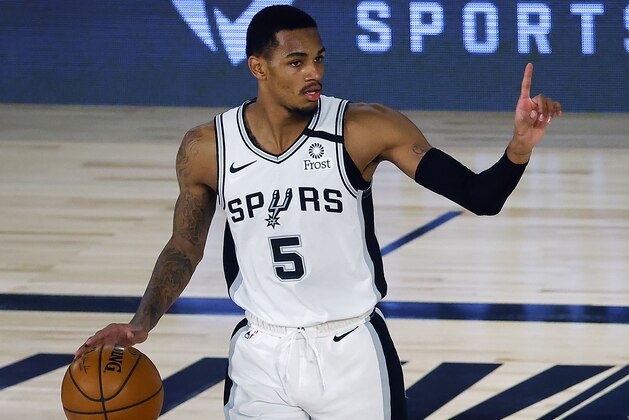 San Antonio Spurs' Dejounte Murray reacts during the second quarter of an NBA basketball game against the Utah Jazz, Thursday, Aug. 13, 2020, in Lake Buena Vista, Fla. (Kevin C. Cox/Pool Photo via AP)