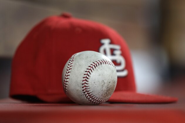 A ball is seen in the dugout with a St. Louis Cardinals hat during the fifth inning of a baseball game between the St. Louis Cardinals and the Arizona Diamondbacks Friday, July 12, 2019, in St. Louis. (AP Photo/Jeff Roberson)