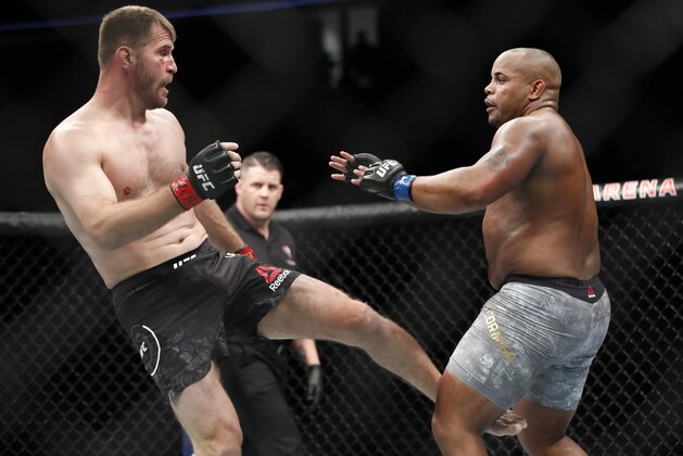 Stipe Miocic kicks Daniel Cormier during a heavyweight title mixed martial arts bout at UFC 226, Saturday, July 7, 2018, in Las Vegas. (AP Photo/John Locher) Stipe Miocic kicks Daniel Cormier during a heavyweight title mixed martial arts bout at UFC 226, Saturday, July 7, 2018, in Las Vegas. (AP Photo/John Locher)