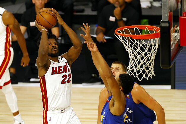 Miami Heat's Jimmy Butler  the shoots against the Denver Nuggets during an NBA basketball game, Saturday, Aug. 1, 2020, in Lake Buena Vista, Fla. (Kevin C. Cox/Pool Photo via AP)