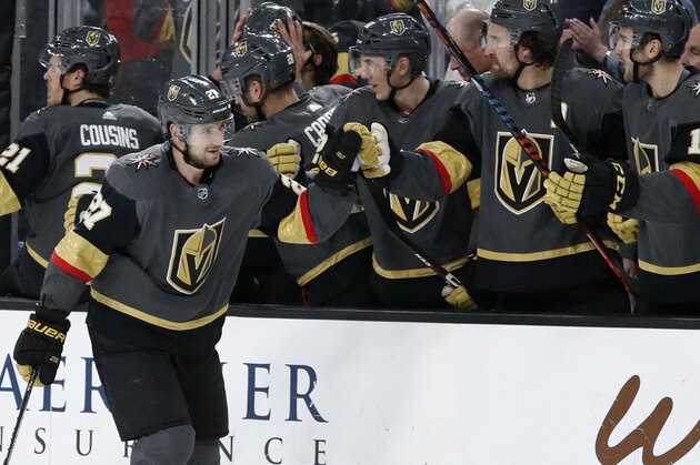 Vegas Golden Knights defenseman Shea Theodore (27) celebrates after scoring against the Edmonton Oilers during the third period of an NHL hockey game Wednesday, Feb. 26, 2020, in Las Vegas. (AP Photo/John Locher)