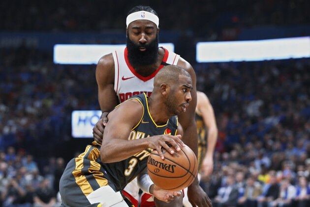 Oklahoma City Thunder guard Chris Paul (3) drives past Houston Rockets guard James Harden during the first half of an NBA basketball game Thursday, Jan. 9, 2020, in Oklahoma City. (AP Photo/Sue Ogrocki)