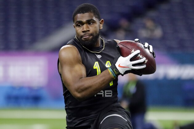 FILE - In this Feb. 28, 2020, file photo, LSU running back Clyde Edwards-Helaire runs a drill at the NFL football scouting combine in Indianapolis. The Chiefs drafted Clyde Edwards-Helaire in the first round. (AP Photo/Michael Conroy, File)