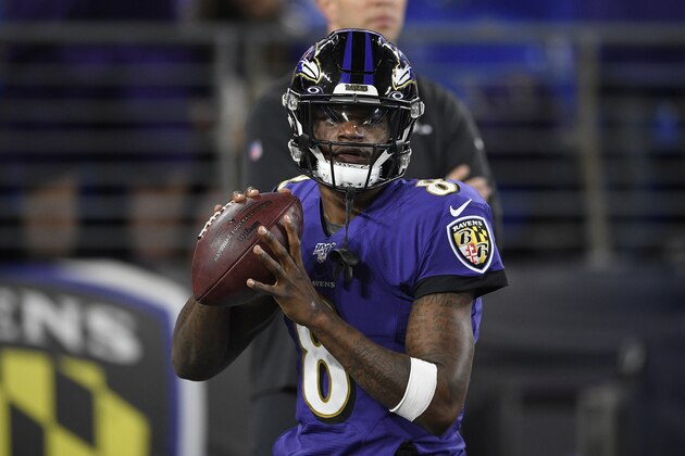 Baltimore Ravens quarterback Lamar Jackson (8) warms up before an NFL divisional playoff football game against the Tennessee Titans, Saturday, Jan. 11, 2020, in Baltimore. (AP Photo/Nick Wass)