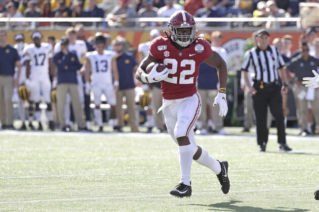 Alabama running back Najee Harris (22) runs against Michigan during the first half of the Citrus Bowl NCAA college football game, Wednesday, Jan. 1, 2020, in Orlando, Fla. (AP Photo/John Raoux)