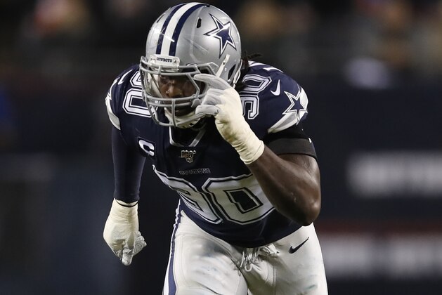 Dallas Cowboys defensive end Demarcus Lawrence (90) rushes in against the Chicago Bears during an NFL football game, Thursday, Dec. 5, 2019, in Chicago. The Bears won 31-24. (Jeff Haynes/AP Images for Panini)