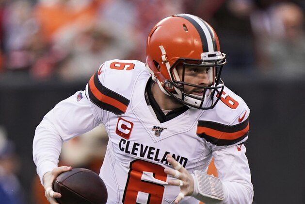 In this Dec. 29, 2019, photo, Cleveland Browns quarterback Baker Mayfield scrambles during the first half of an NFL football game against the Cincinnati Bengals in Cincinnati. The most compelling dramas in the NFL this season unfolded on the field, not off of it. And any thought that the league was in jeopardy of losing its spot as America's favorite sport has been set on the back burner. (AP Photo/Bryan Woolston) In this Dec. 29, 2019, photo, Cleveland Browns quarterback Baker Mayfield scrambles during the first half of an NFL football game against the Cincinnati Bengals in Cincinnati. The most compelling dramas in the NFL this season unfolded on the field, not off of it. And any thought that the league was in jeopardy of losing its spot as America's favorite sport has been set on the back burner. (AP Photo/Bryan Woolston)