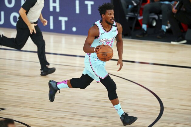 Miami Heat forward Jimmy Butler (22) dribbles against the Indiana Pacers during the first half of an NBA basketball game Monday, Aug. 10, 2020, in Lake Buena Vista, Fla. (Kim Klement/Pool Photo via AP)