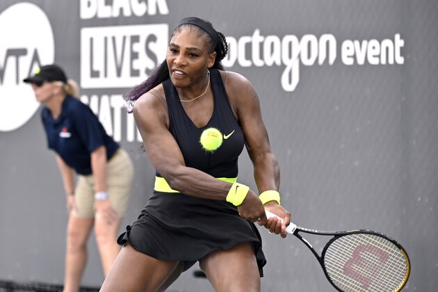 Serena Williams returns a shot to her sister Venus Williams during the WTA tennis tournament in Nicholasville, Ky., Thursday, Aug. 13, 2020. (AP Photo/Timothy D. Easley)