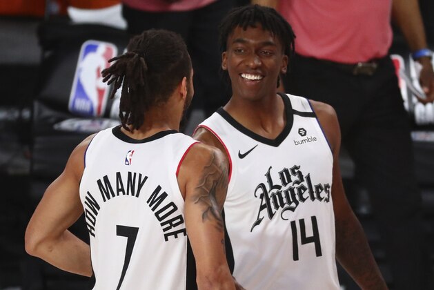 Los Angeles Clippers' guard Amir Coffey (7) celebrates with guard Terance Mann (14) after defeating the Denver Nuggets in an NBA basketball game Wednesday, Aug. 12, 2020, in Lake Buena Vista, Fla. (Kim Klement/Pool Photo via AP) Los Angeles Clippers' guard Amir Coffey (7) celebrates with guard Terance Mann (14) after defeating the Denver Nuggets in an NBA basketball game Wednesday, Aug. 12, 2020, in Lake Buena Vista, Fla. (Kim Klement/Pool Photo via AP)