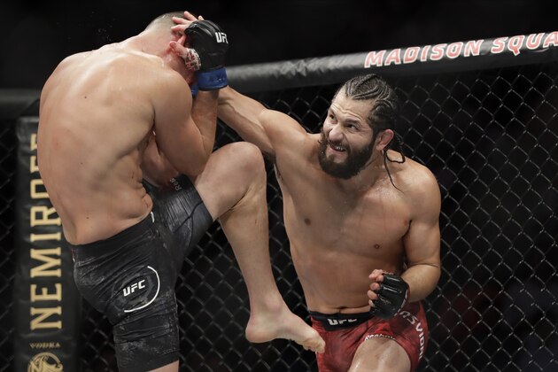 Jorge Masvidal, right, punches Nate Diaz during the second round of a welterweight mixed martial arts bout at UFC 244 early Sunday, Nov. 3, 2019, in New York. Masvidal won in the fourth round. (AP Photo/Frank Franklin II)