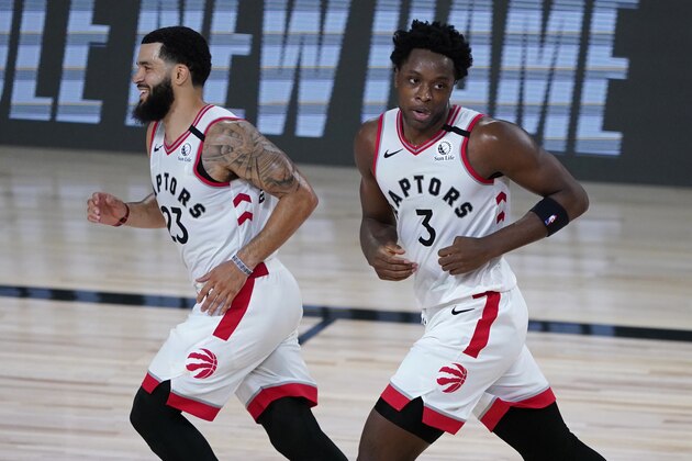 Toronto Raptors' Fred VanVleet, left, and OG Anunoby react after defeating the Los Angeles Lakers in an NBA basketball game Saturday, Aug. 1, 2020, in Lake Buena Vista, Fla. (AP Photo/Ashley Landis, Pool)