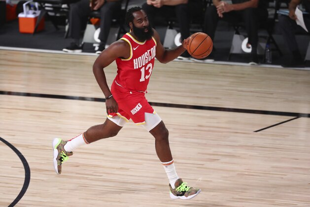 Houston Rockets guard James Harden (13) brings the ball upcourt in the first half of an NBA basketball game Wednesday, Aug. 12, 2020, in Lake Buena Vista, Fla. (Kim Klement/Pool Photo via AP)